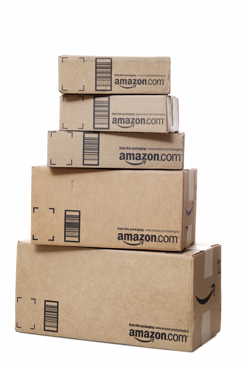 Chattanooga, USA - November 15, 2011: A stack of several Amazon.com packages on white background.